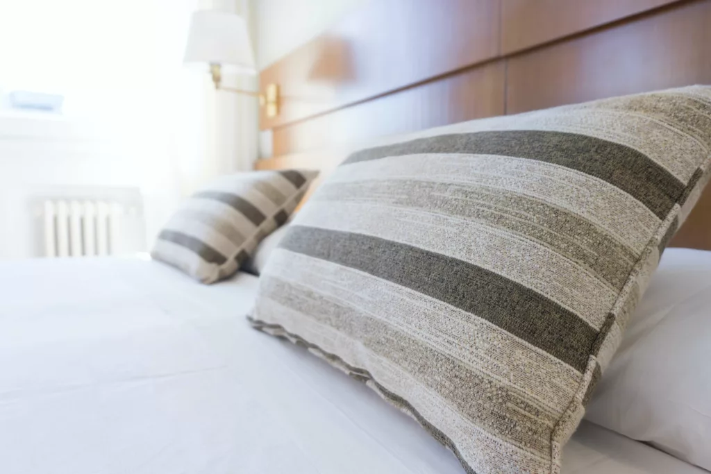 Clean Bed with Pillows Neatly Placed - Ellijay House Cleaning